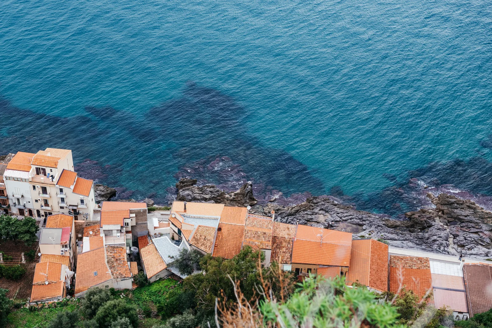 Cefalù rooftops meeting turquoise shallow water