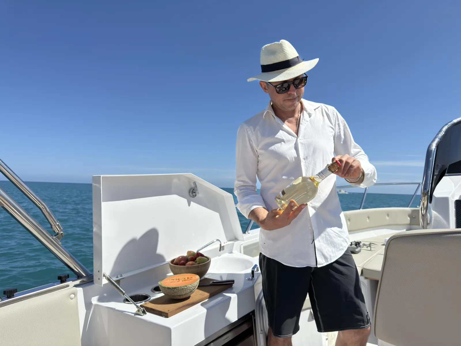 The skipper preparing food on the aft deck during the charter