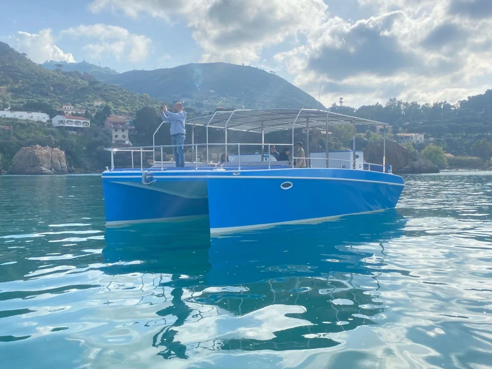 The catamaran seen bow-on, showing the twin hulls and the wide flat deck between them